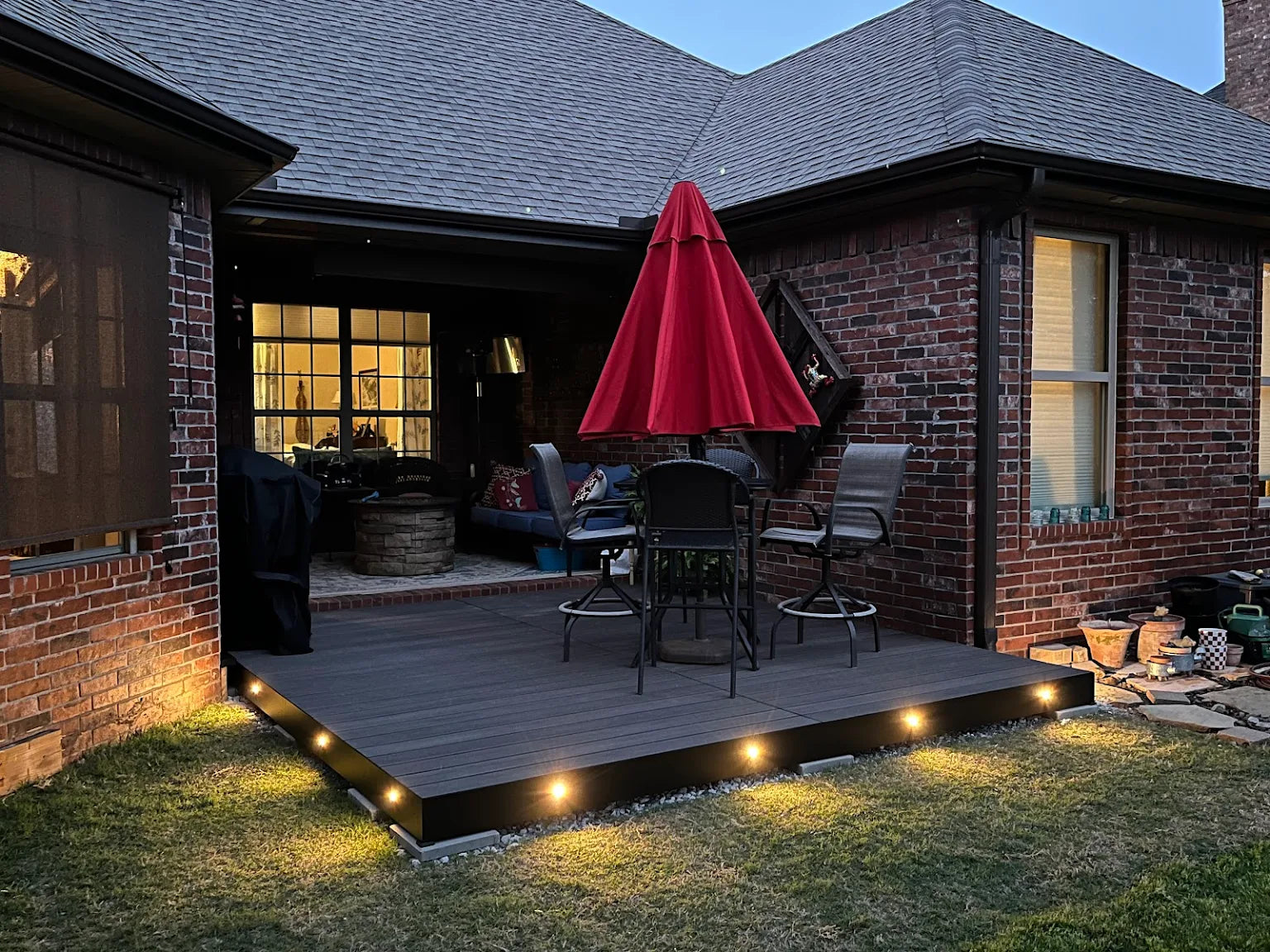 Aluminum deck with composite decking installed in a customers backyard for a patio