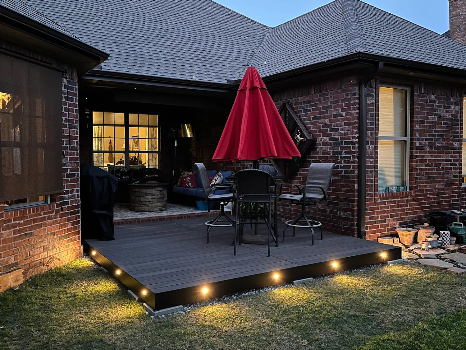 Aluminum deck with composite decking installed in a customers backyard for a patio