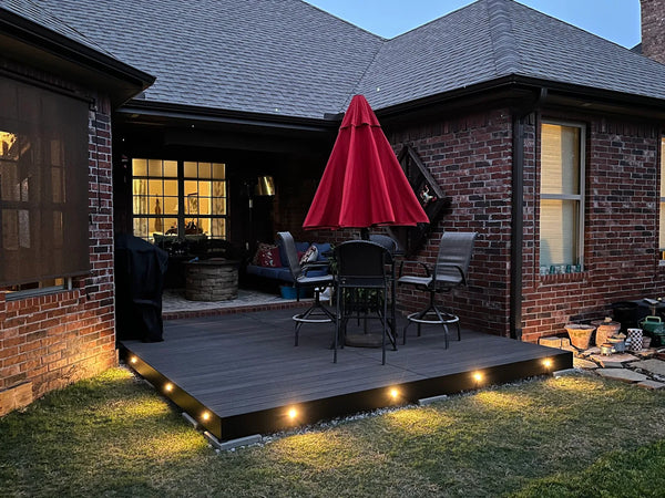 Aluminum deck with composite decking installed in a customers backyard for a patio